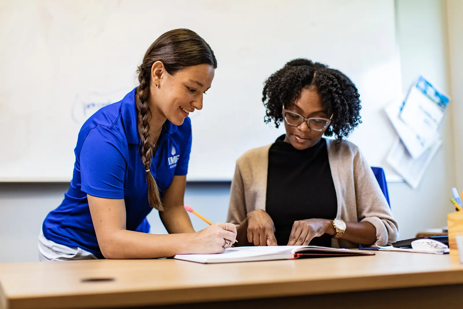 IMG Academy tutor working with student